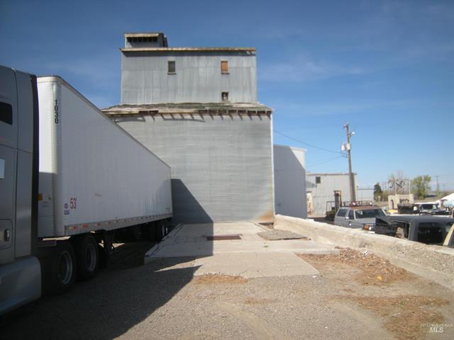 Outside of Grain Elevator with Truck in Hazelton, Idaho